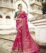 Rani pink woven silk saree with blouse