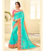 green embroidered satin saree with blouse