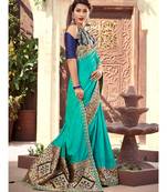 green embroidered silk blend saree with blouse