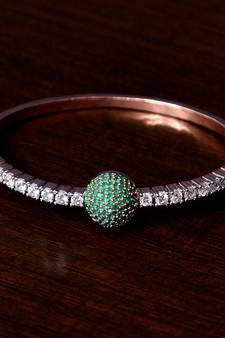 Rose gold plated emerald stone and diamond embellished light weight bracelet