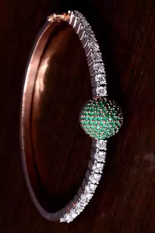 Rose gold plated emerald stone and diamond embellished light weight bracelet