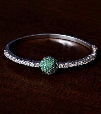 Rhodium plated emerald stone and diamond embellished light weight bracelet 1