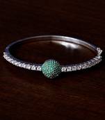 Rhodium plated emerald stone and diamond embellished light weight bracelet