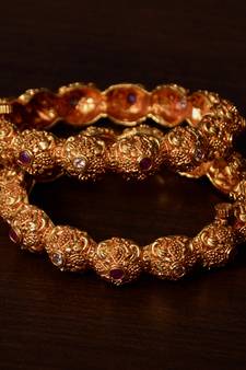 Ruby and Kundan Stone Embellished Gold Plated Temple Worked Bangles
