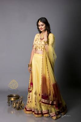 Pale Yellow Brocade And Net Flared Lehenga Choli Dupatta Set 1