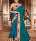 Teal embroidered satin saree with blouse