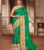 Green embroidered satin saree with blouse