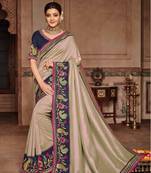 Ivory embroidered satin saree with blouse