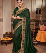 Dark green embroidered satin saree with blouse