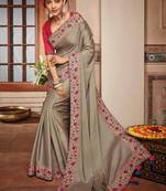 Beige embroidered satin saree with blouse