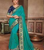 Teal embroidered satin saree with blouse