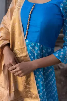 blue bandhani anarkali with golden dupatta