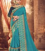   turquoise embroidered fancy fabric saree with blouse