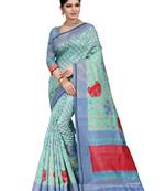 Turquoise woven raw silk saree with blouse