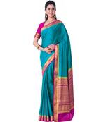 Turquoise woven Crepe saree with blouse