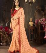 Peach embroidered georgette saree with blouse