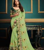 Light green embroidered satin saree with blouse