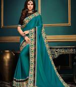 Light teal embroidered satin saree with blouse