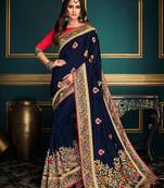 Blue embroidered satin saree with blouse