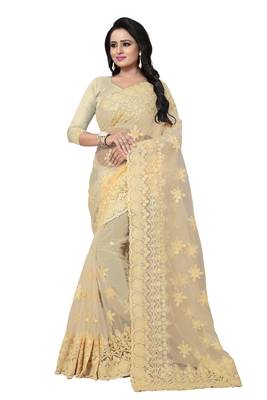 Beige embroidered net saree with blouse 1