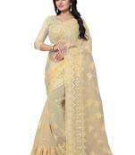 Beige embroidered net saree with blouse