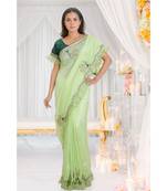 green embroidered crepe saree with blouse
