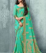 Turquoise woven faux jute saree with blouse