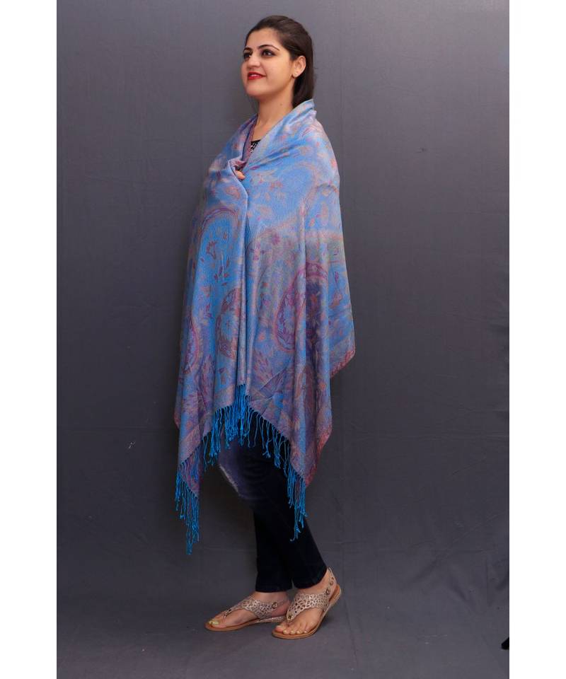 Delicate Wrap Along With Sky Blue Colour Base And Paisley Pattern On Stole Looks Elegant.