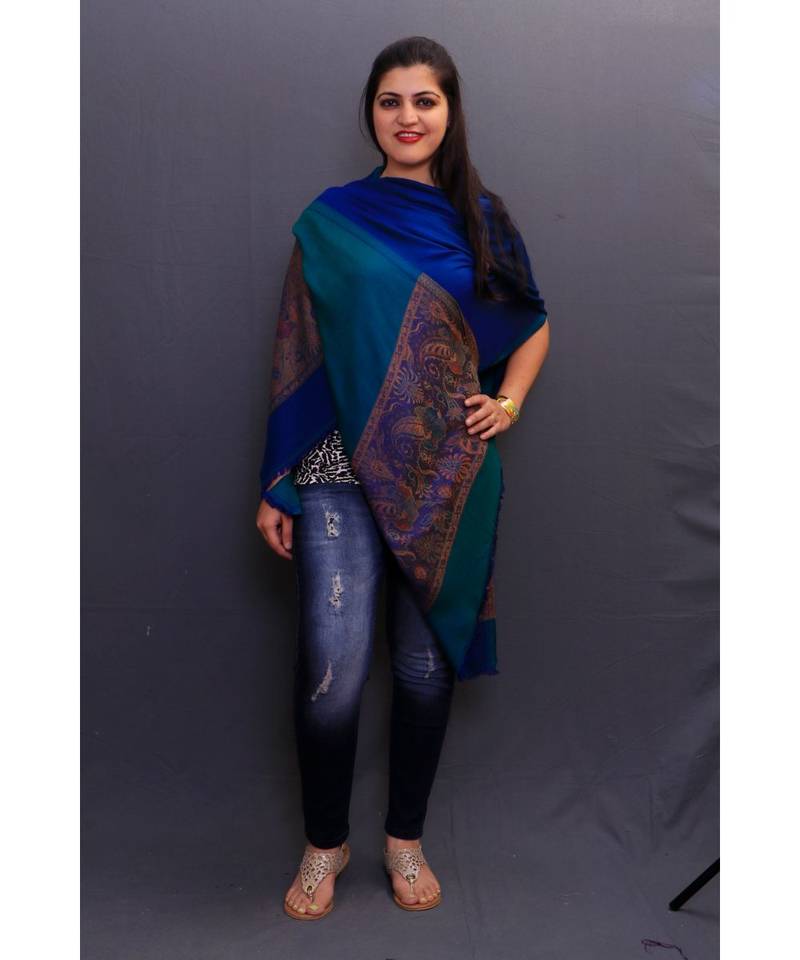 Reversible Delicate Wrap Along With Royal Blue Base And Highly Defined Border Gains Whole Attention.