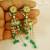 Handpainted Emerald Kundan Jhumka Earrings