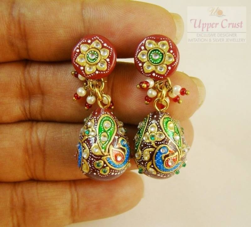Ruby Handpainted peacock motif kundan jhumka earrings