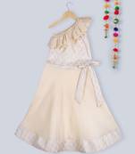 golden one sided off shoulder brocade choli with matching beige bow lehnga