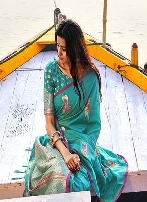   turquoise woven silk blend saree with blouse 2