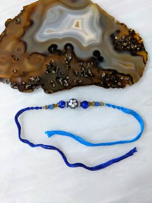 Flower Designer Silver Ring With Navy Blue Beads Thread Rakhi For Brother 1