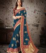 Dark green embroidered art silk saree with blouse