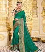 Green embroidered satin saree with blouse