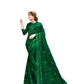 Dark green embroidered chiffon saree with blouse