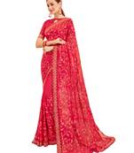 Dark pink embroidered georgette saree with blouse