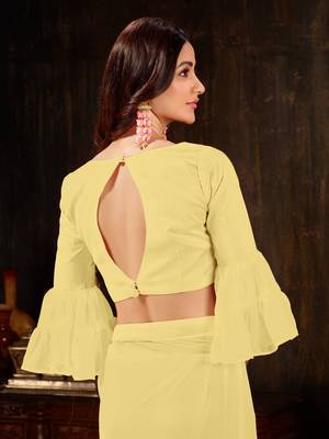 Yellow plain georgette ruffle saree with blouse 5