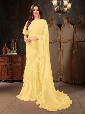 Yellow plain georgette ruffle saree with blouse 1