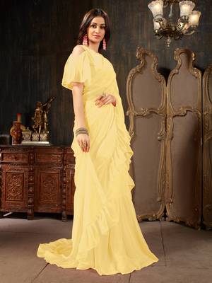 Yellow plain georgette ruffle saree with blouse 3