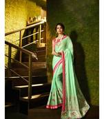 green embroidered satin saree with blouse