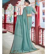 turquoise printed georgette saree with blouse