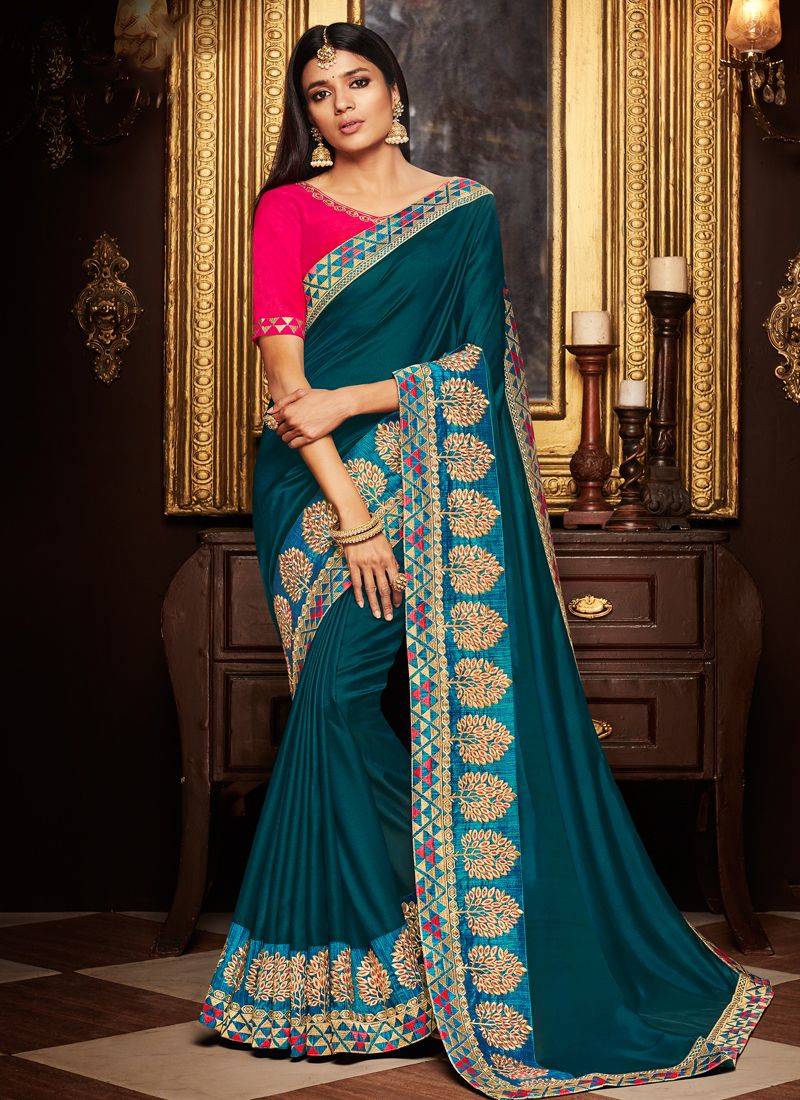Dark teal embroidered silk saree with blouse
