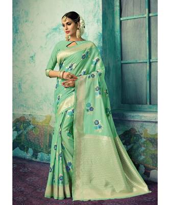 Green woven silk blend saree with blouse 1