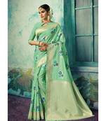 Green woven silk blend saree with blouse
