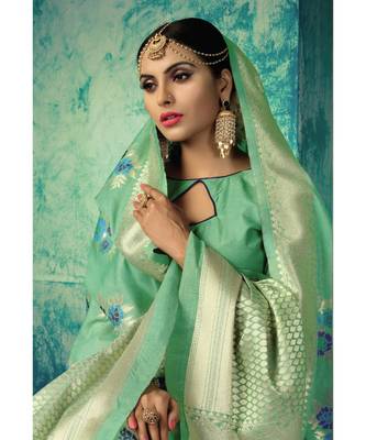 Green woven silk blend saree with blouse 2