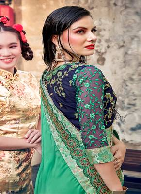   sea green embroidered georgette saree with blouse 2