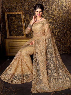 Golden embroidered net saree with blouse 1