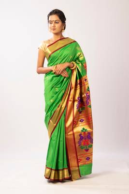 Green hand woven silk blend saree with blouse 1